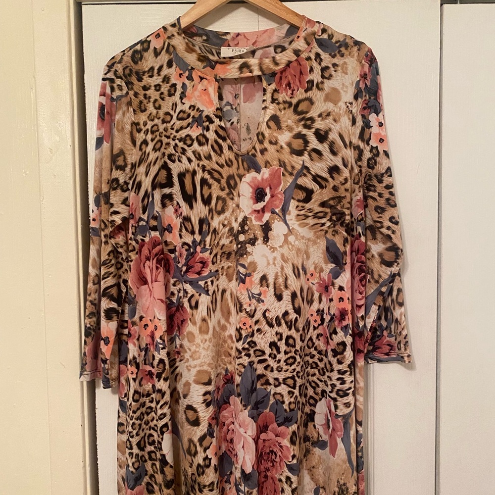 Leopard print dress with different color flowers.